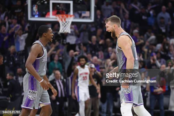 SACRAMENTO, CALIFORNIA - NOVEMBER 20: DeAaron Fox #5 and Domantas Sabonis #10 of the Sacramento Kings celebrate after a three-point basket in the fourth quarter against the Detroit Pistons at Golden 1 Center on November 20, 2022 in Sacramento, California. NOTE TO USER: User expressly acknowledges and agrees that, by downloading and/or using this photograph, User is consenting to the terms and conditions of the Getty Images License Agreement. (Photo by Lachlan Cunningham/Getty Images)