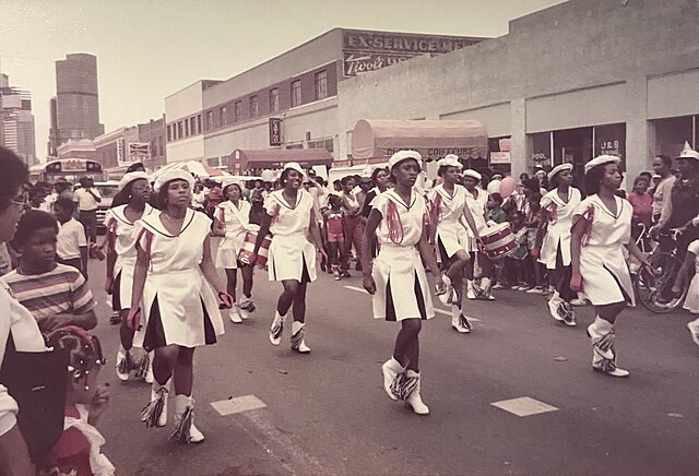 Juneteenth parade in Denver heading north from downtown toward the corner of York and ??? circ 1983