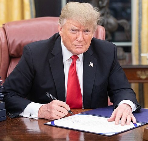 President Trump at his desk from WikipediaCommons