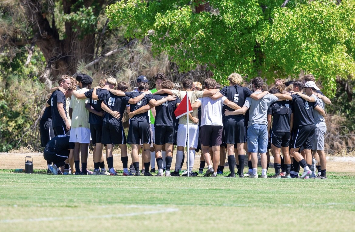Butte Men's Soccer team huddle, Aug 22 2025