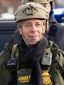 Greg Bovino in uniform, contently staring off into the distance