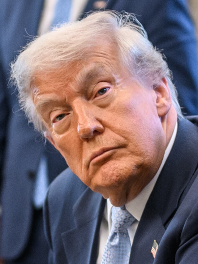 President Donald Trump, looking ahead, directly into the camera