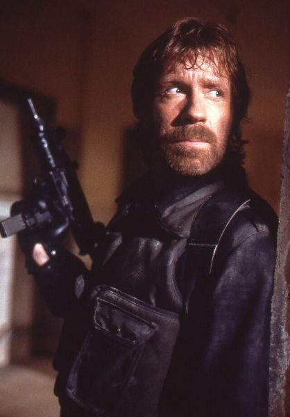 Chuck Norris peaks around the corner in a still shot from his 1986 film, “Delta Force.”