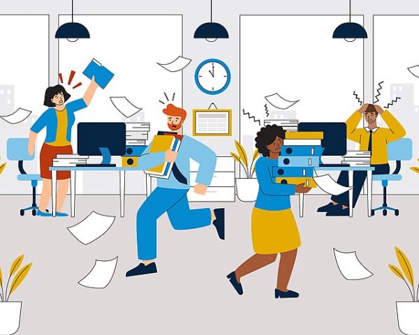 A cartoon picture with four characters in an office, looking stressed, with papers in the air, and upset faces.